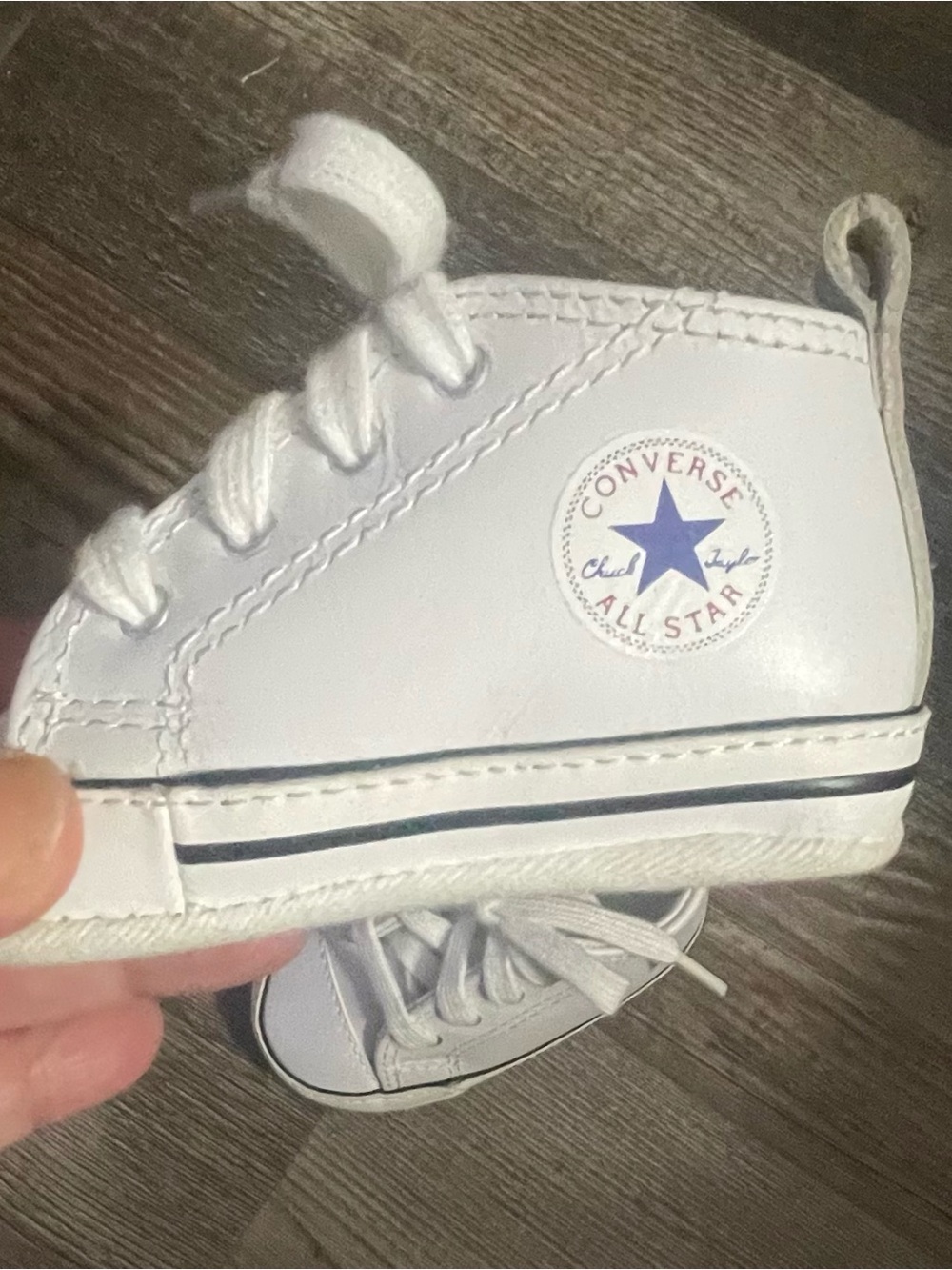 Converse Chuck Taylor First Star leather baby toddler crib shoes are a size 2.
